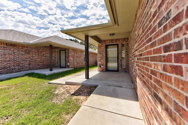 316 SW 4th Pl, Newcastle, OK 73065 - view of exterior entry featuring brick siding and a shingled roof
