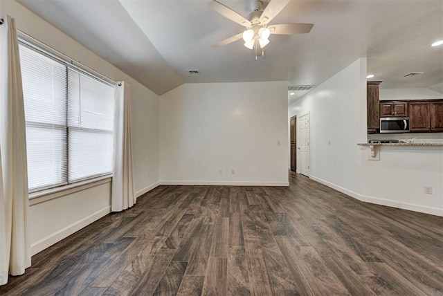 316 SW 4th Pl, Newcastle, OK 73065 - unfurnished living room with lofted ceiling, dark wood-type flooring, ceiling fan, baseboards, and recessed lighting