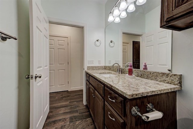 316 SW 4th Pl, Newcastle, OK 73065 - bathroom with vanity, wood finished floors, and baseboards