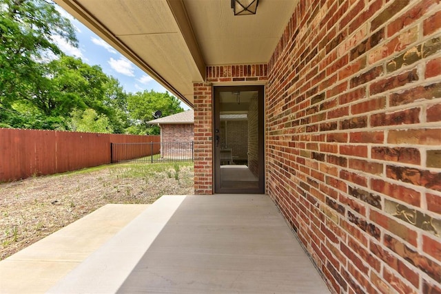 316 SW 4th Pl, Newcastle, OK 73065 - entrance to property featuring fence, brick siding, and a patio