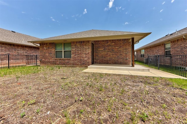 316 SW 4th Pl, Newcastle, OK 73065 - back of property with a patio, a fenced backyard, and brick siding