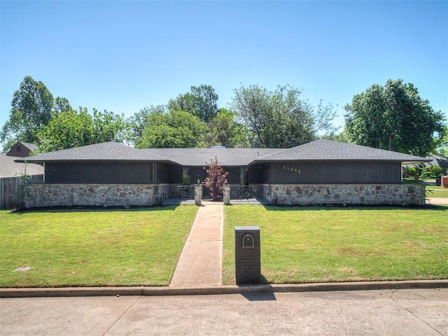 11008 Blue Sage Rd, Oklahoma City, OK 73120 - view of front facade featuring a front yard and stone siding