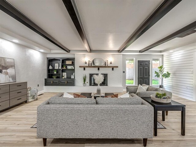 11008 Blue Sage Rd, Oklahoma City, OK 73120 - living room featuring light wood-style floors, beam ceiling, and baseboards
