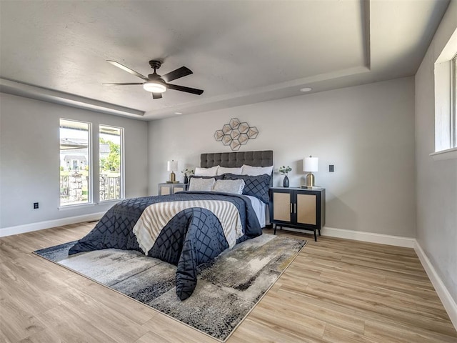 11008 Blue Sage Rd, Oklahoma City, OK 73120 - bedroom featuring multiple windows, baseboards, and wood finished floors