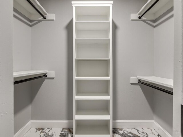 11008 Blue Sage Rd, Oklahoma City, OK 73120 - walk in closet with light marble finish flooring