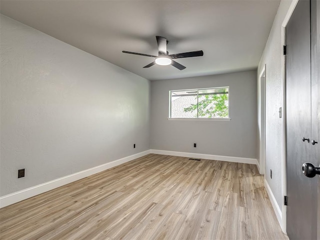 11008 Blue Sage Rd, Oklahoma City, OK 73120 - unfurnished bedroom featuring light wood-type flooring, baseboards, and ceiling fan
