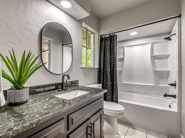 11008 Blue Sage Rd, Oklahoma City, OK 73120 - full bathroom with a textured wall, shower / bath combo, toilet, vanity, and tile patterned floors