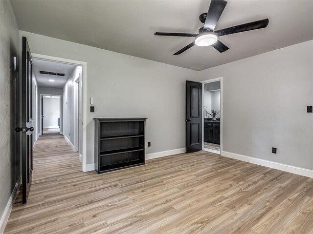 11008 Blue Sage Rd, Oklahoma City, OK 73120 - empty room with light wood-style flooring, a ceiling fan, and baseboards