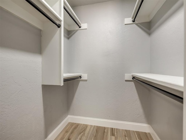 11008 Blue Sage Rd, Oklahoma City, OK 73120 - walk in closet featuring light wood-style floors
