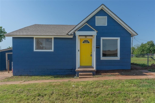 view of front of home featuring roof with shingles