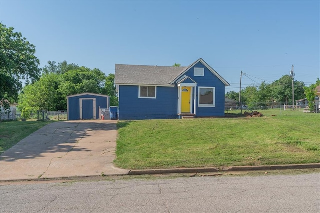 view of front facade featuring concrete driveway, a storage shed, and an outdoor structure