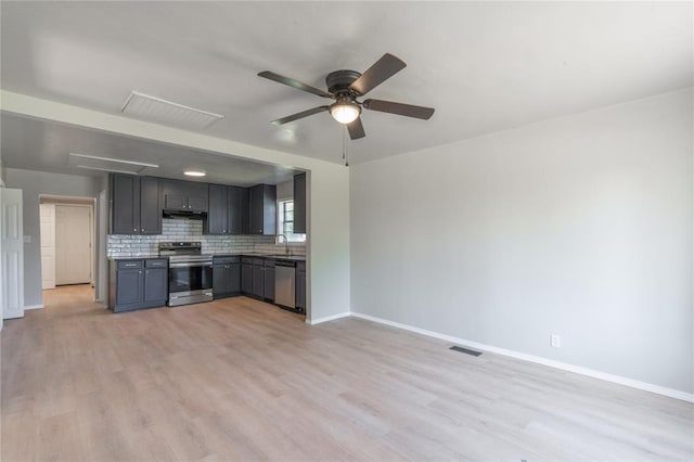 kitchen featuring stainless steel appliances, ceiling fan, light wood-style floors, and under cabinet range hood