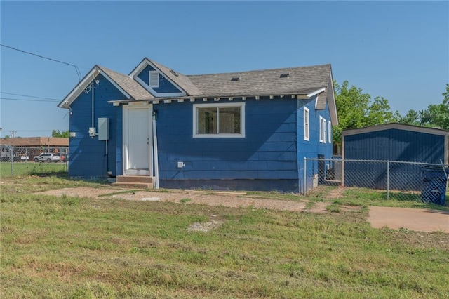 bungalow featuring entry steps and a shingled roof