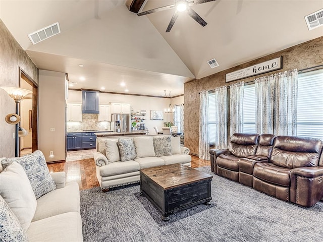 living room with a ceiling fan, high vaulted ceiling, light wood-type flooring, and beamed ceiling