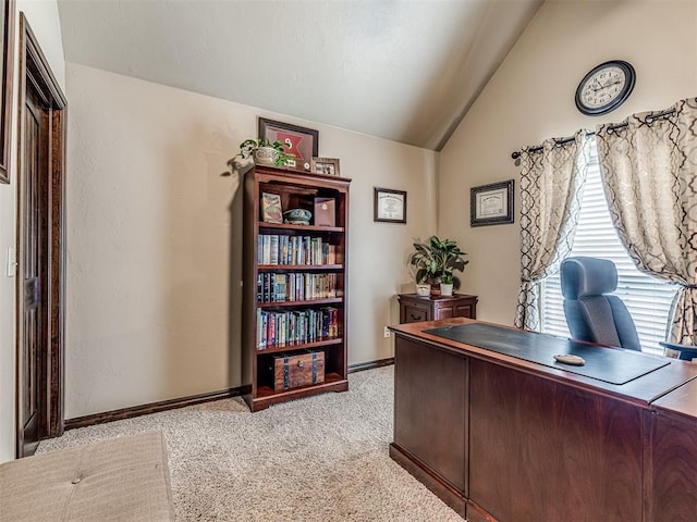 office with light colored carpet, lofted ceiling, and baseboards