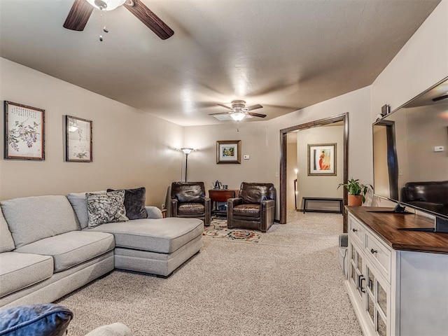 living room with ceiling fan and light carpet