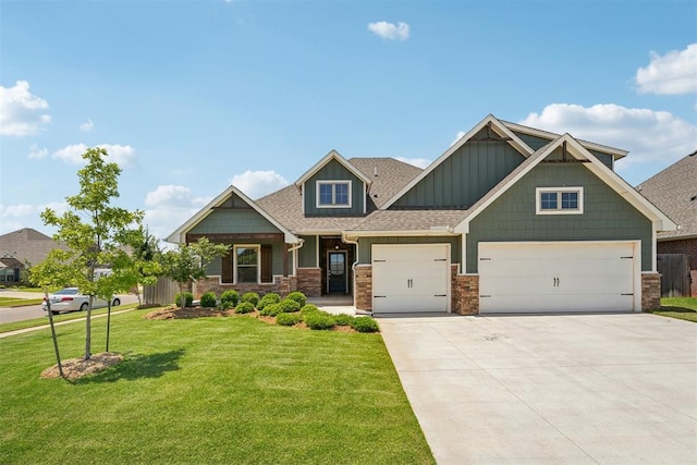 craftsman-style house featuring driveway, a front yard, board and batten siding, a shingled roof, and a garage