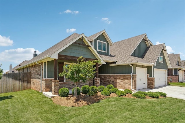 craftsman-style home with board and batten siding, driveway, and roof with shingles