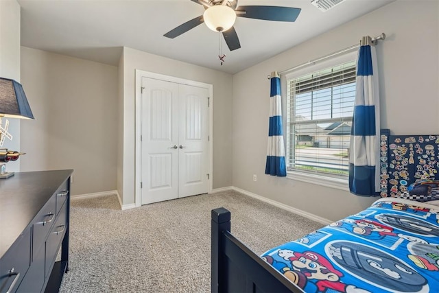 bedroom with carpet floors, a closet, baseboards, and ceiling fan