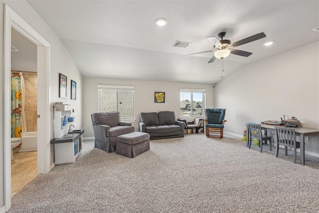 living area featuring carpet, ceiling fan, baseboards, recessed lighting, and lofted ceiling