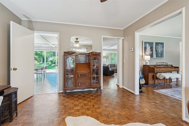 1219 Westchester Dr, Oklahoma City, OK 73114 - entryway featuring a ceiling fan, crown molding, and baseboards