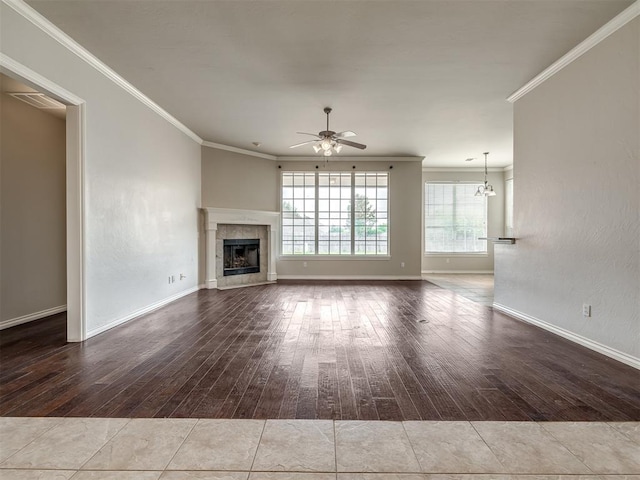 16104 Ledge Ln, Edmond, OK 73013 - unfurnished living room featuring a ceiling fan, hardwood / wood-style flooring, ornamental molding, a fireplace, and baseboards