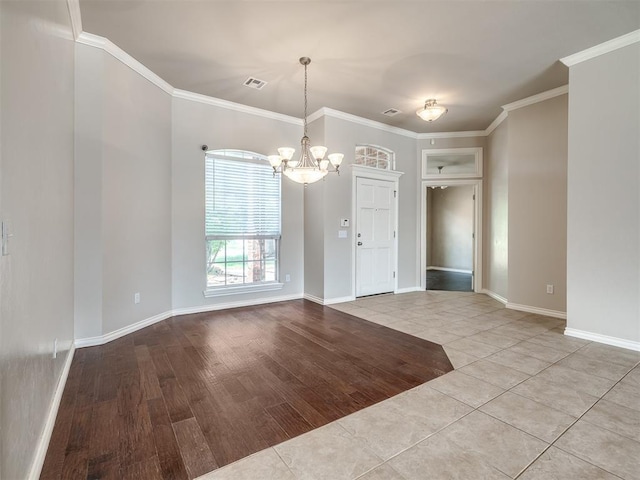16104 Ledge Ln, Edmond, OK 73013 - unfurnished dining area featuring a chandelier, ornamental molding, baseboards, and wood finished floors