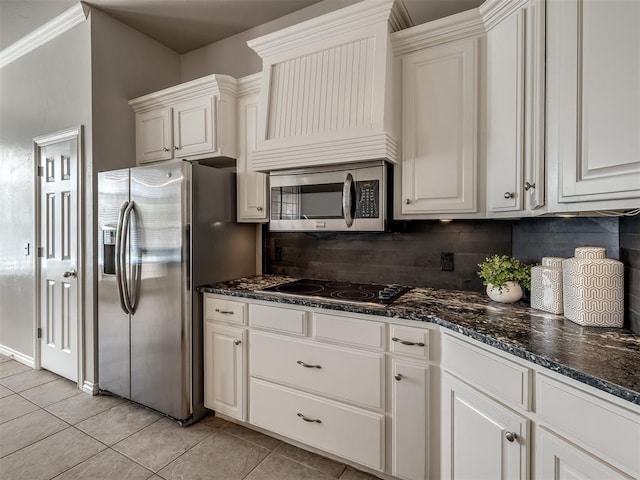 16104 Ledge Ln, Edmond, OK 73013 - kitchen with stainless steel appliances, decorative backsplash, light tile patterned flooring, and dark stone countertops
