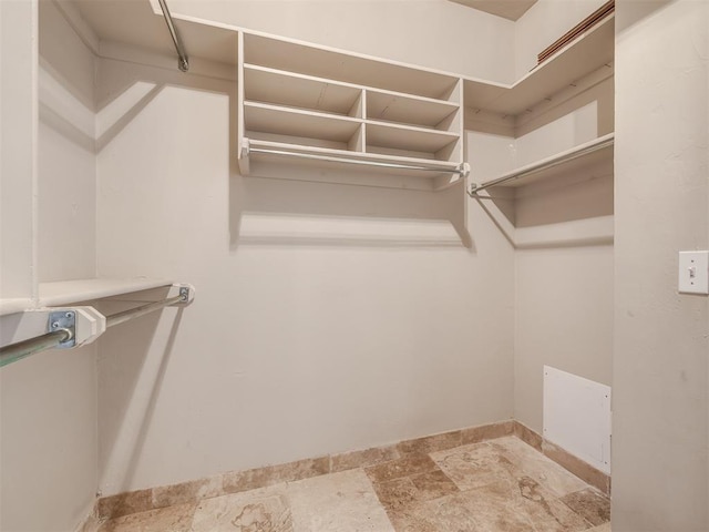 16104 Ledge Ln, Edmond, OK 73013 - spacious closet with stone finish floors