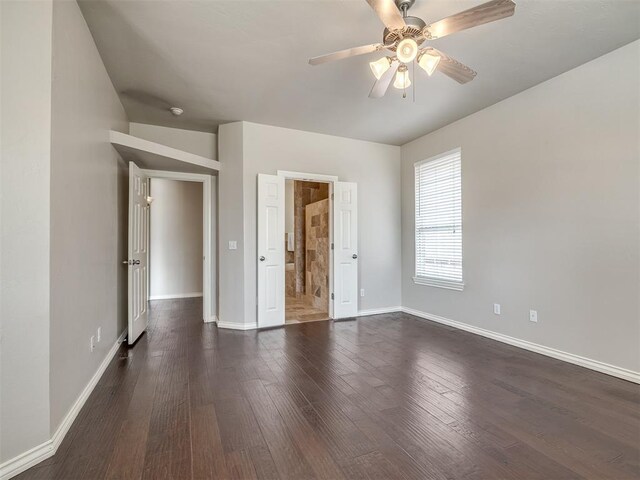 16104 Ledge Ln, Edmond, OK 73013 - unfurnished bedroom with baseboards, dark wood finished floors, ceiling fan, and ensuite bath