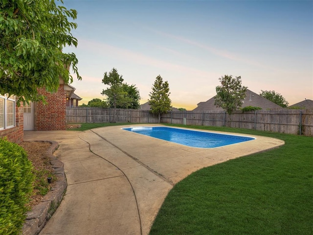 16104 Ledge Ln, Edmond, OK 73013 - pool at dusk with a patio area