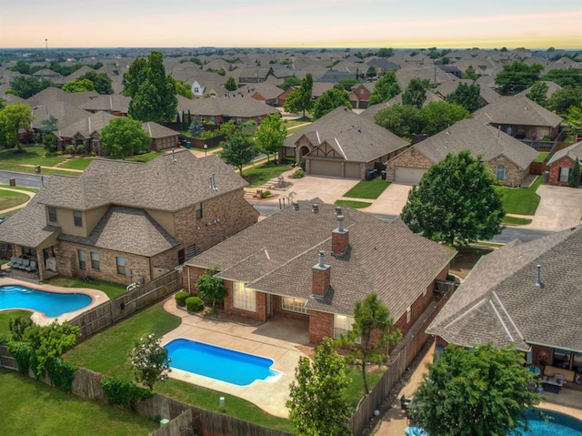 16104 Ledge Ln, Edmond, OK 73013 - aerial view at dusk of view of pool and a residential view