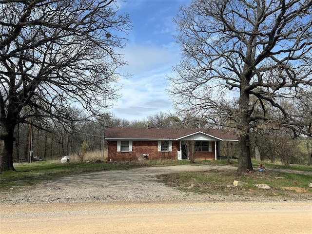520 Dozer Rd, Sulphur, OK 73086 - view of front of house featuring driveway and brick siding