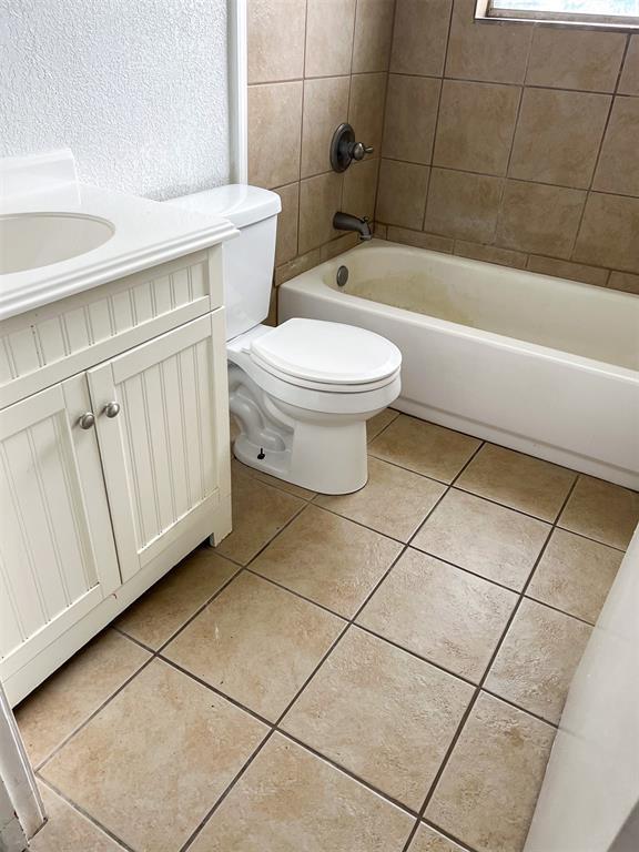 520 Dozer Rd, Sulphur, OK 73086 - bathroom featuring tile patterned flooring, toilet, and vanity