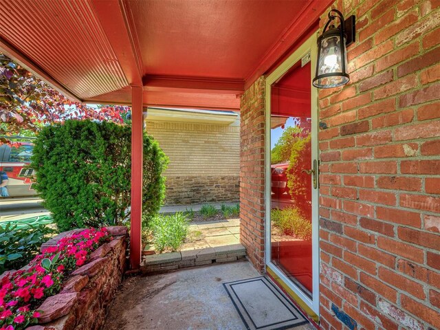 1738 Westchester Dr, Oklahoma City, OK 73120 - view of exterior entry featuring brick siding