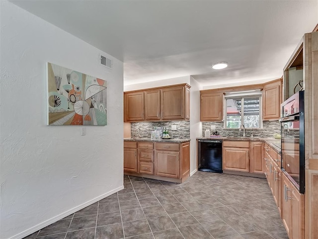 1738 Westchester Dr, Oklahoma City, OK 73120 - kitchen featuring black appliances, tasteful backsplash, a sink, light stone countertops, and baseboards