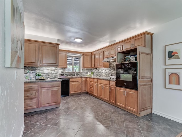 1738 Westchester Dr, Oklahoma City, OK 73120 - kitchen with black appliances, under cabinet range hood, decorative backsplash, dark tile patterned floors, and a sink