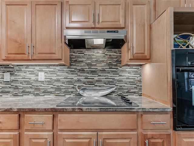 1738 Westchester Dr, Oklahoma City, OK 73120 - kitchen featuring under cabinet range hood, black appliances, light brown cabinetry, and backsplash