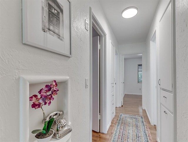 1738 Westchester Dr, Oklahoma City, OK 73120 - hall with light wood finished floors and a textured wall