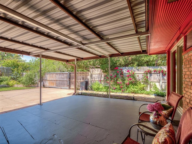 1738 Westchester Dr, Oklahoma City, OK 73120 - view of patio / terrace with fence and a carport
