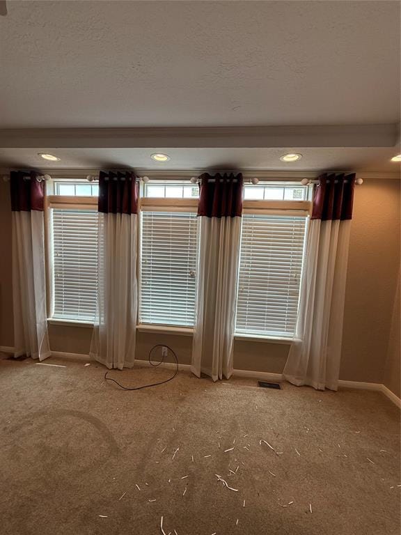 106 Sundown Ct, Mcloud, OK 74851 - carpeted empty room featuring baseboards, recessed lighting, and a textured ceiling
