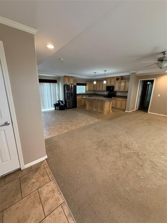 106 Sundown Ct, Mcloud, OK 74851 - unfurnished living room with baseboards, a ceiling fan, recessed lighting, ornamental molding, and light tile patterned flooring