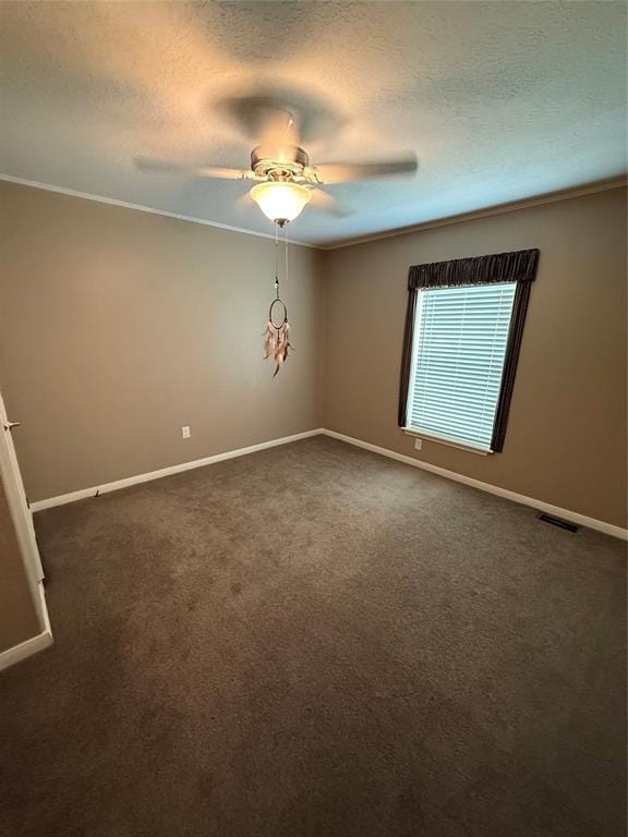 106 Sundown Ct, Mcloud, OK 74851 - empty room with baseboards, a textured ceiling, dark colored carpet, a ceiling fan, and crown molding