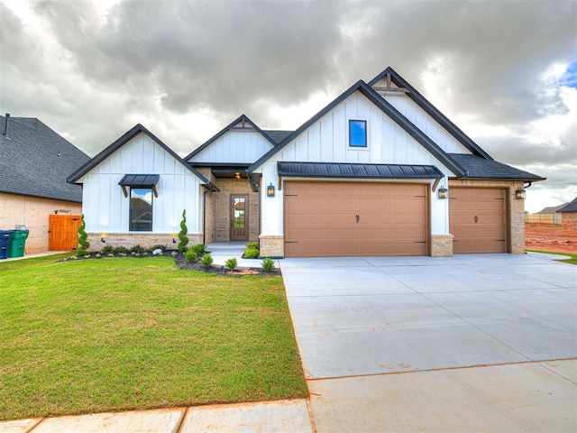 10424 SW 51st St, Mustang, OK 73064 - view of front of property with board and batten siding, a garage, concrete driveway, and brick siding