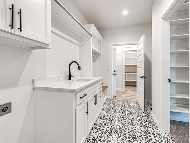 10424 SW 51st St, Mustang, OK 73064 - laundry room with electric dryer hookup, baseboards, cabinet space, and recessed lighting