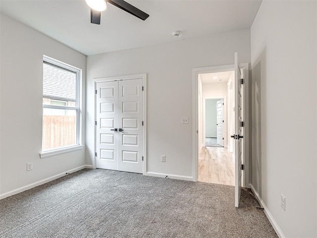 10424 SW 51st St, Mustang, OK 73064 - unfurnished bedroom with carpet flooring, baseboards, a closet, and ceiling fan