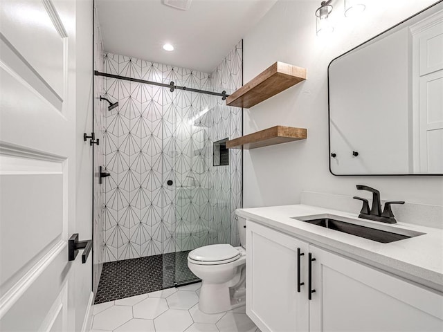 10424 SW 51st St, Mustang, OK 73064 - bathroom featuring toilet, a tile shower, tile patterned flooring, vanity, and recessed lighting