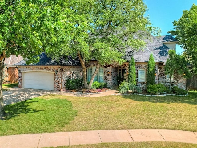 3605 Abbotsford, Norman, OK 73072 - view of front facade with a front lawn, brick siding, an attached garage, and driveway