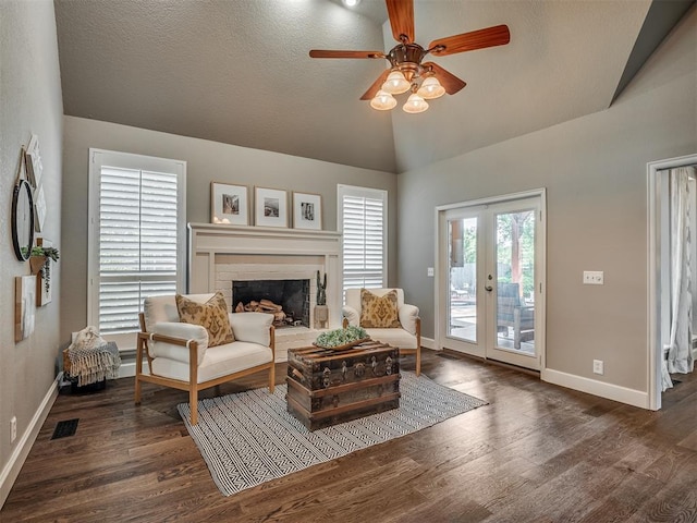 3605 Abbotsford, Norman, OK 73072 - living room with lofted ceiling, a ceiling fan, dark wood-style floors, a fireplace, and baseboards