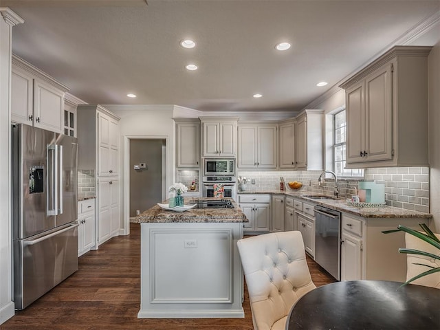 3605 Abbotsford, Norman, OK 73072 - kitchen featuring appliances with stainless steel finishes, a sink, a center island, light stone counters, and recessed lighting